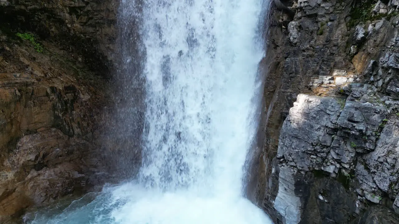 Rushing Waterfall Flows into Bubbling Blue Water [4K Slow Motion