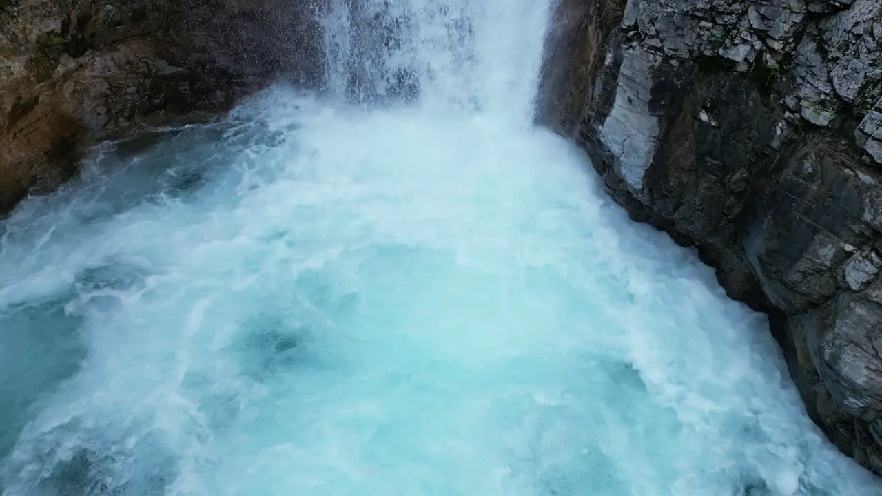 Waterfall Flowing into Bubbling Pool of Blue Water [4K Slow Motion