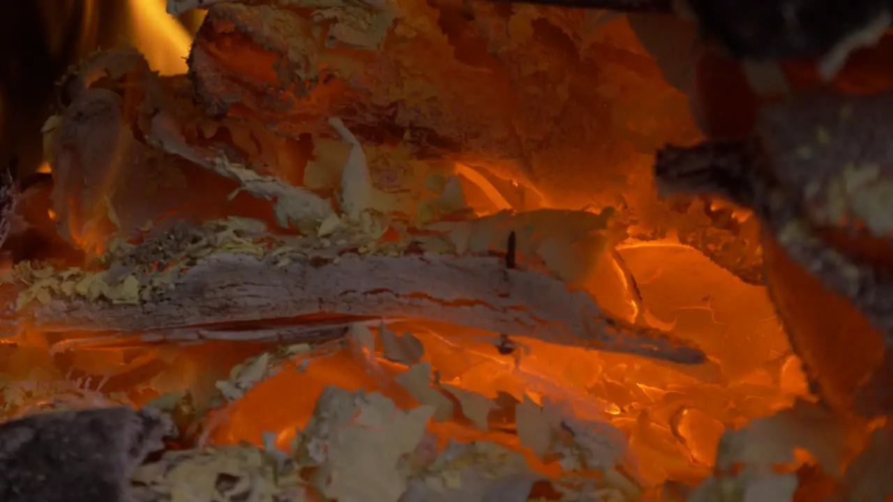 Hot embers in a fire place with wood burning