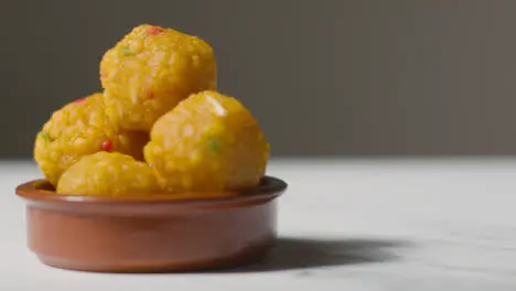 Close Up Of Laddoo In Bowl Celebrating Muslim Festival Of Eid