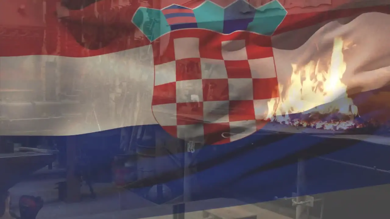 Animation of croatian flag waving over fire burning on barbecue grill at commercial restaurant