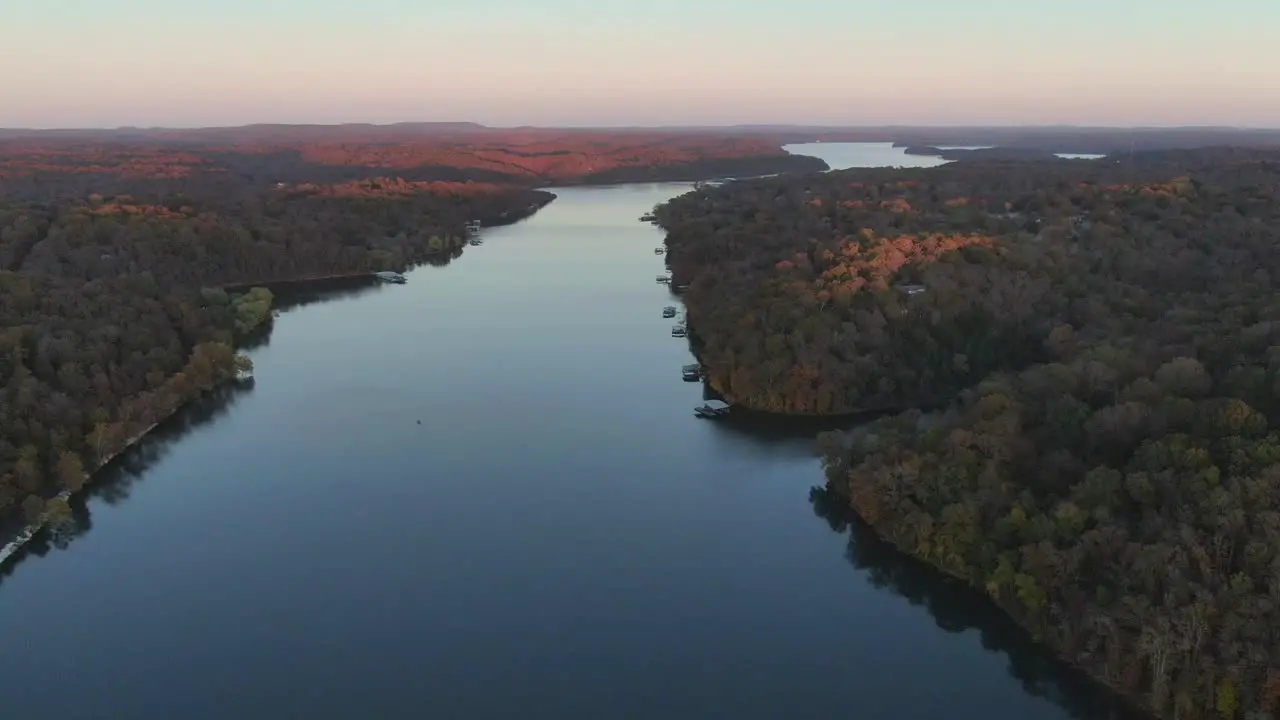 lake amidst fall colors on the horizon high altitude aerial view