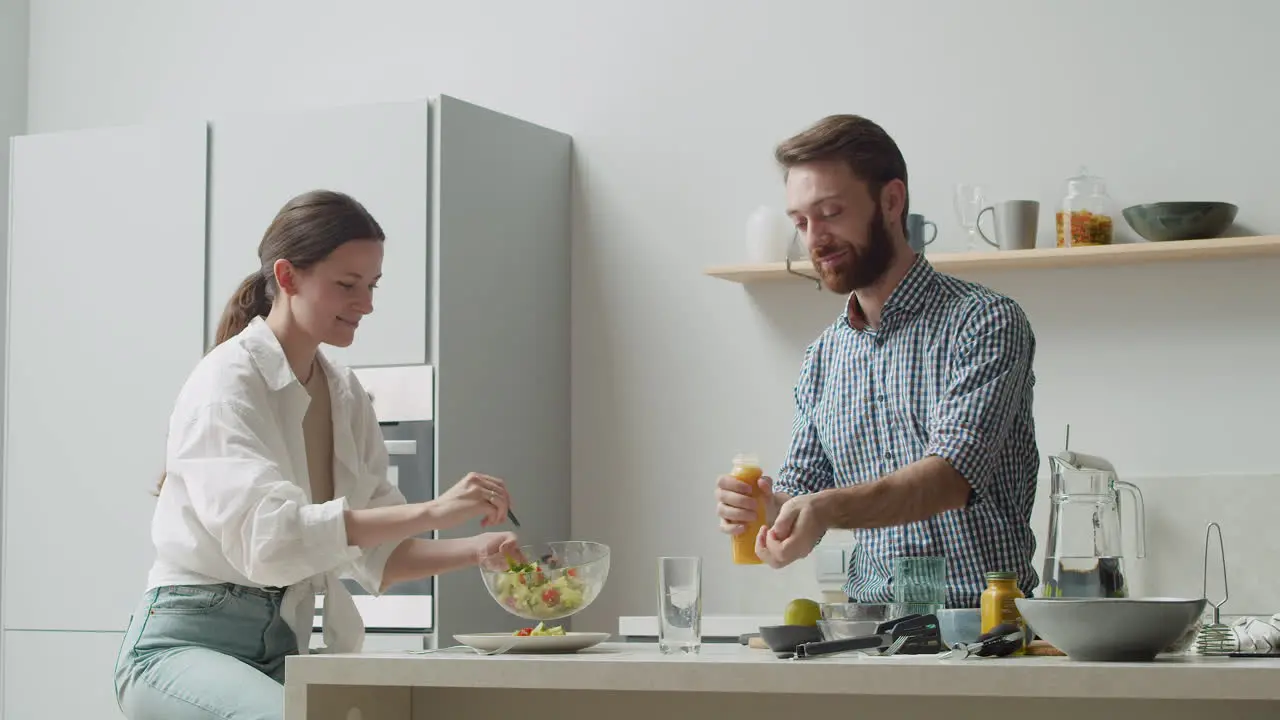 Laughing Couple Ready To Have Lunch With A Delicious And Healthy Salad