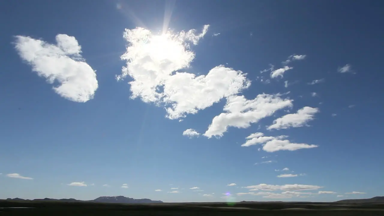 Iceland moving clouds with sunflare timelapse c