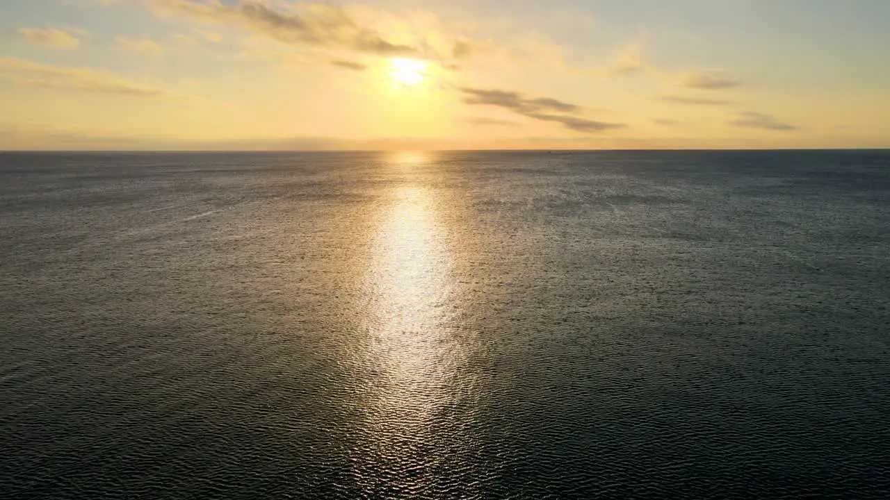 Sunrise of the ocean in Miami pointing at the sun