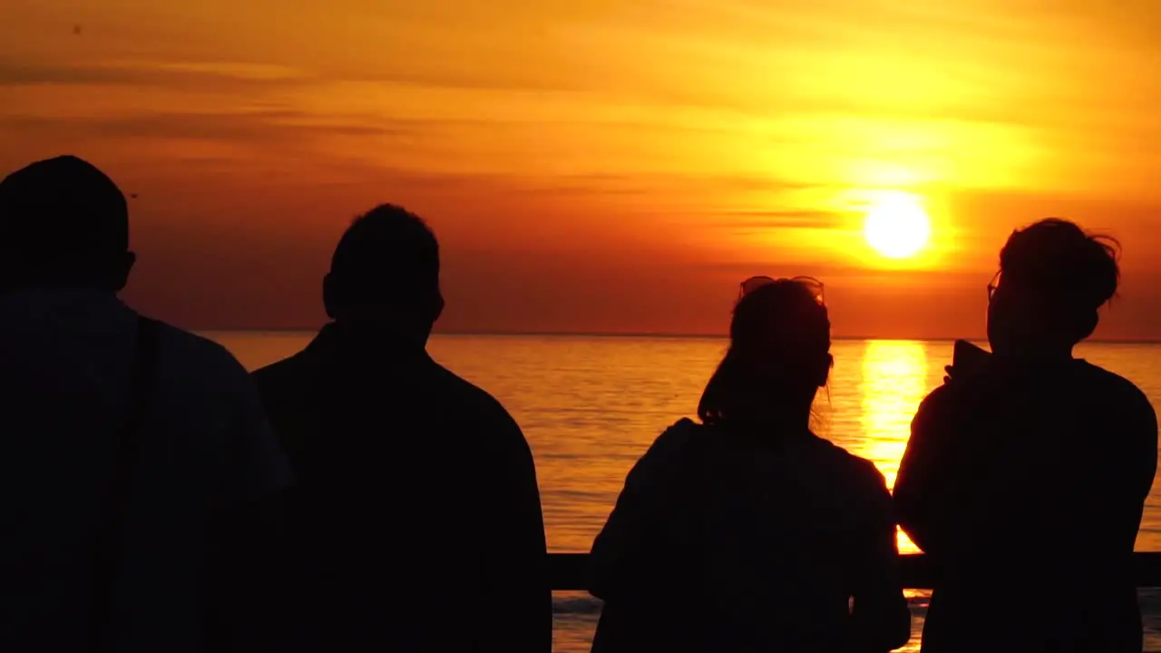 Family watching the sunset at Santa Monica pier