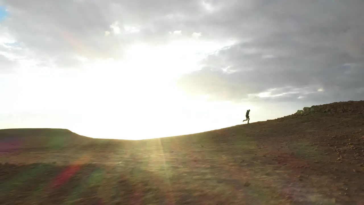 Determination Concept Man Running Uphill in Negev Desert Aerial