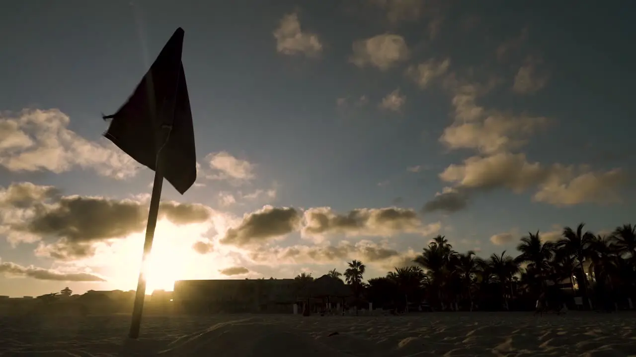 A flag waving in the wind during the sunset