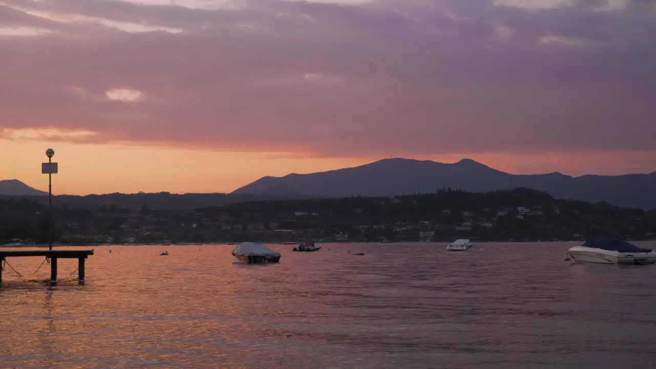 Golden twilight shining on surface of Lake Garda Manerba del Garda Italy