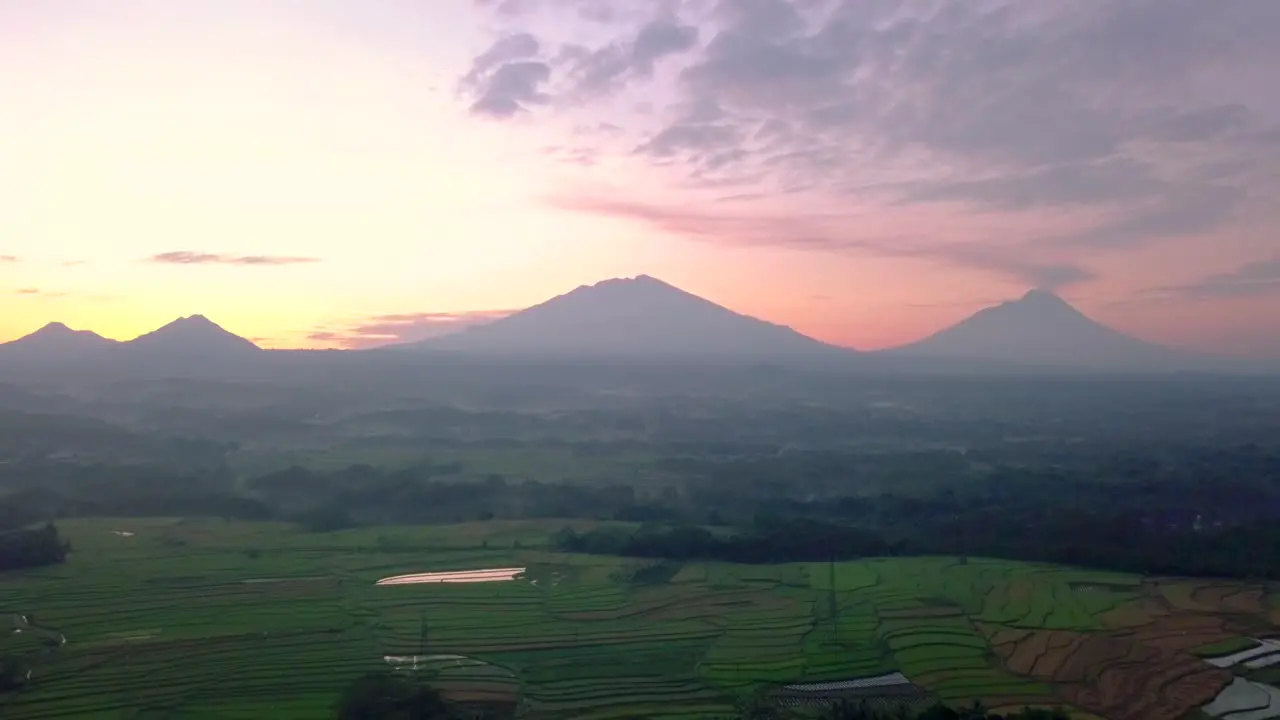 rural sunrise view with four volcanoes