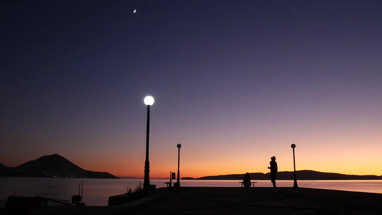 Epic shot of a purple sunset view from a pier