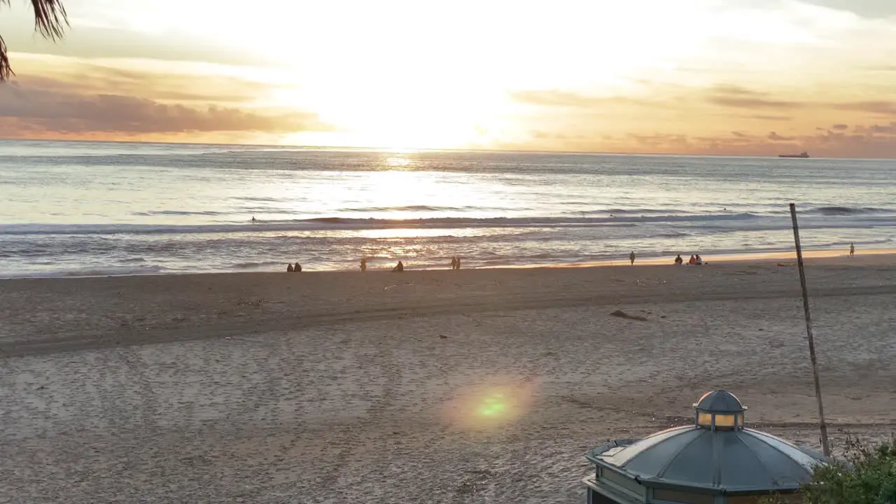 Slow motion of ocean wave hitting beach on a beautiful Europe sunset