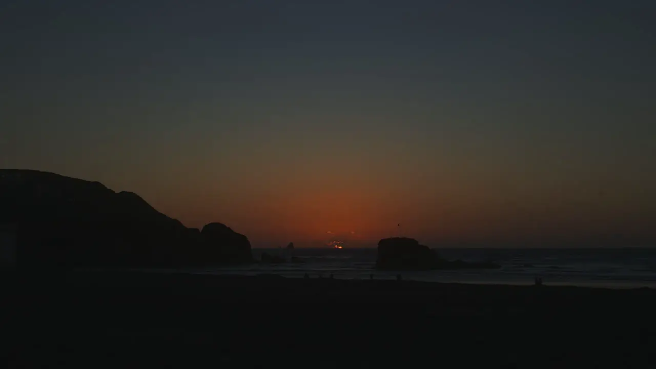 Time lapse of sunset behind Chapel Rock at Perranporth Beach