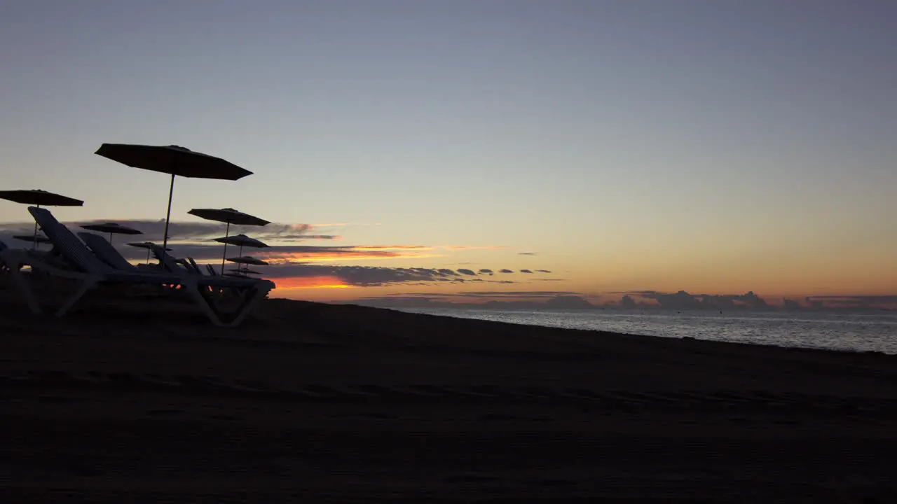 Beach Sunrise Timelapse with Parasols in Spain