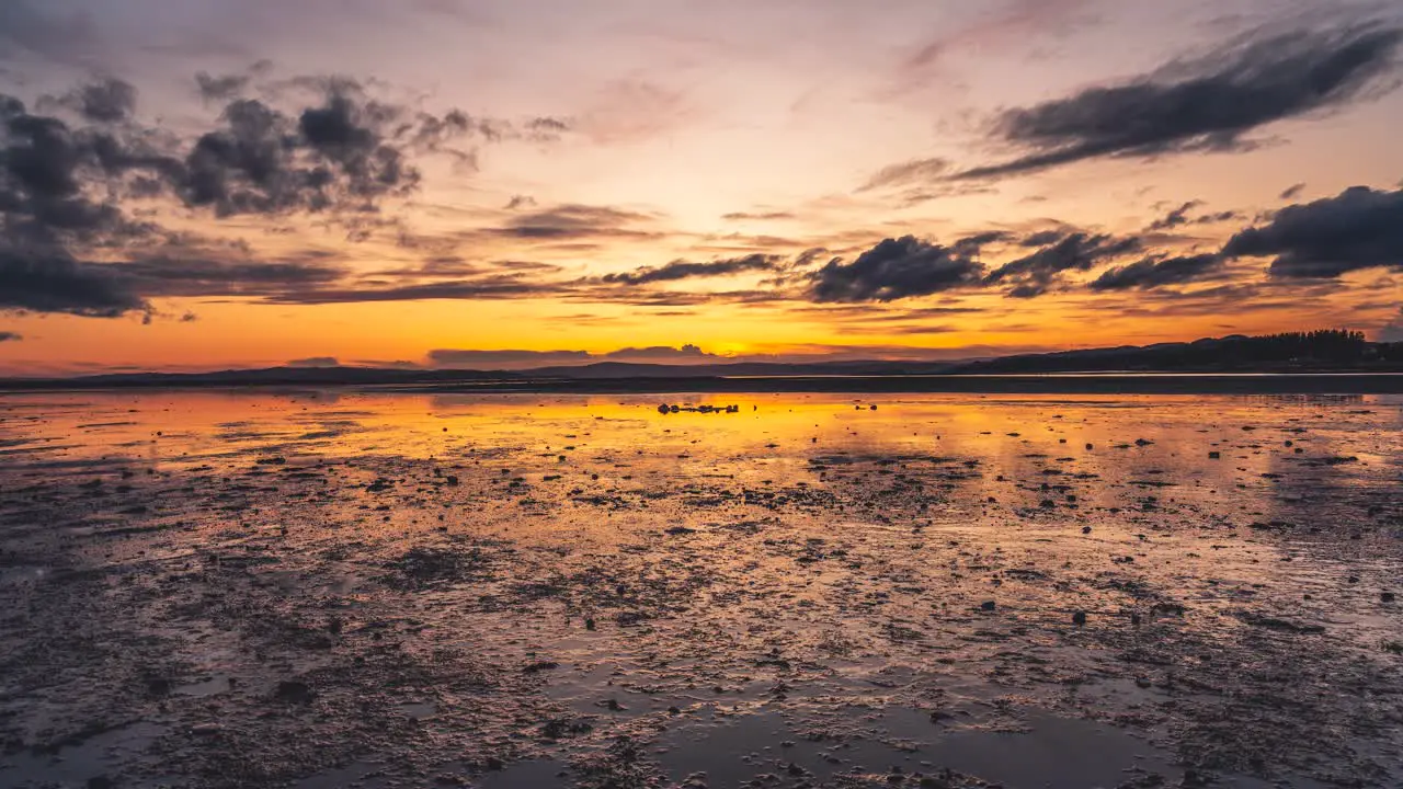 Sunset over low tide in one of norwegian fjords