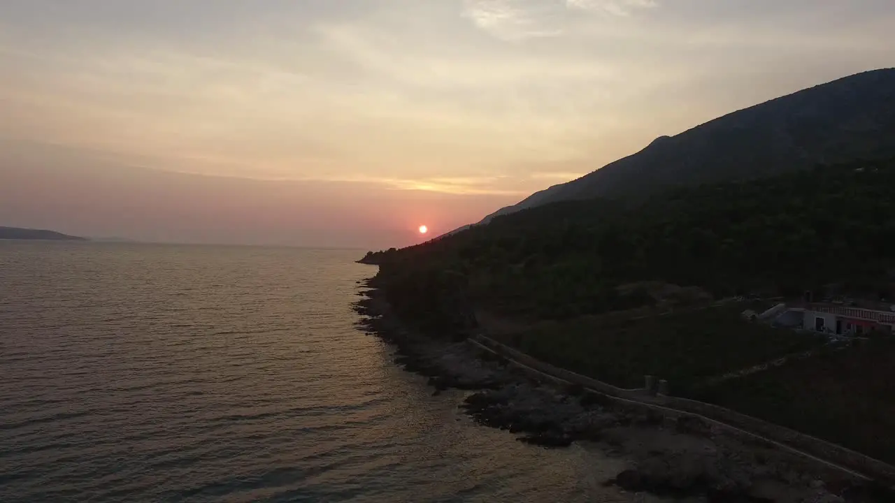 Ascending aerial view of sunset on the coast of Croatia