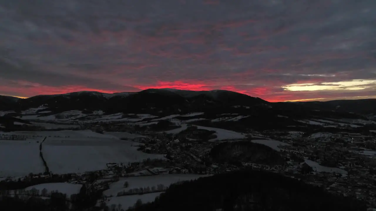 The fiery red sunset behind the mountains of Jesenik Czech Republic wide shot