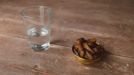 Handheld Shot of Dates and Water