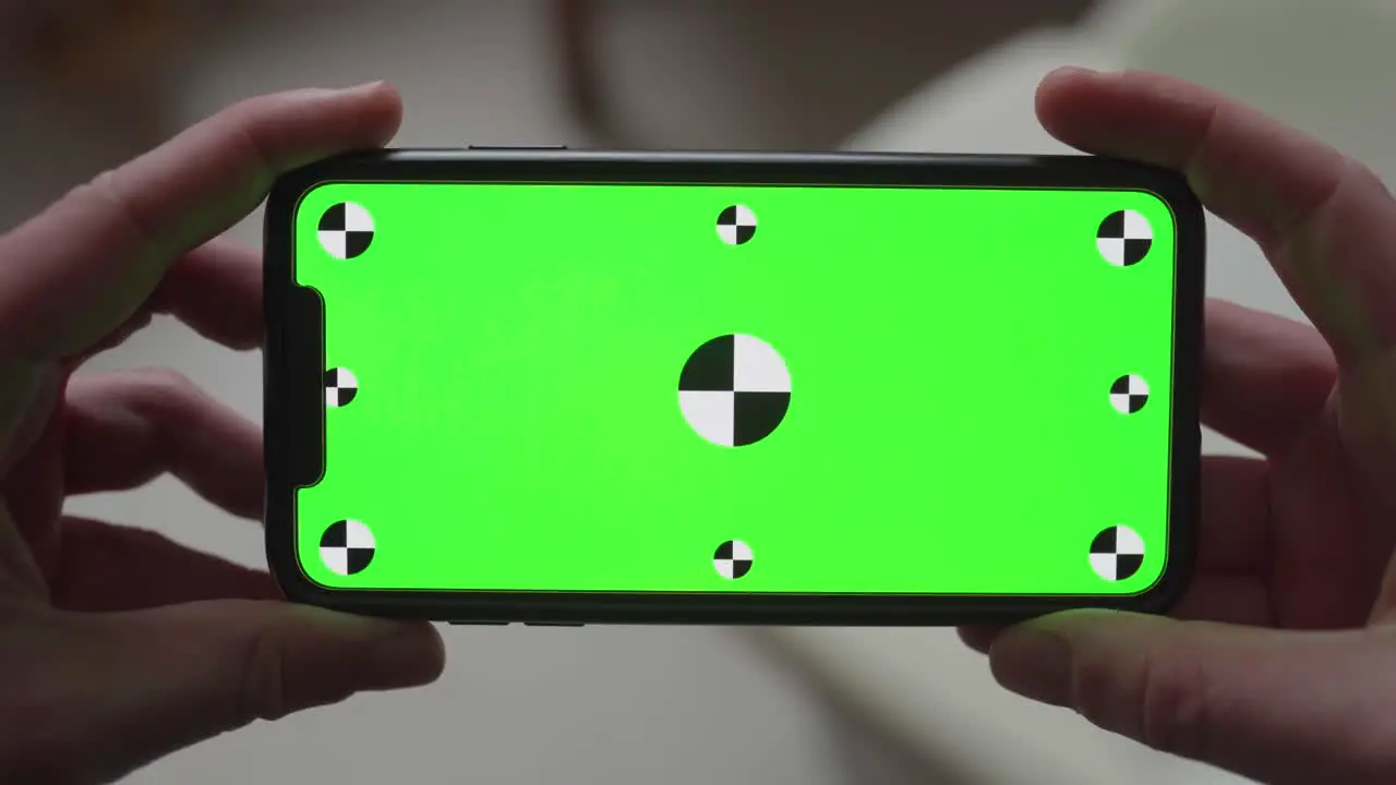 Close-up of latest smartphone technology with integrated green screen