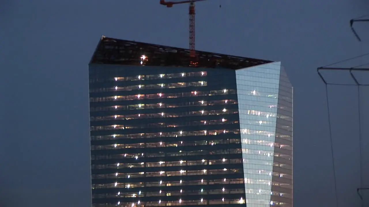 The Camera Pans Up A Chicago Skyscraper With An Unusual Dramatic Shape To The Crane On The Top