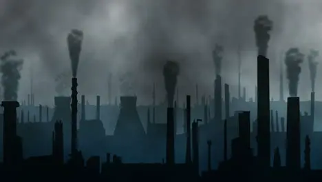 A factory town with chimneys blowing dark clouds