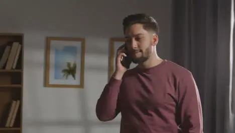 Disappointed Man At Home Receiving Phone Call Telling Him He Has Been Unsuccessful In Job Interview 1