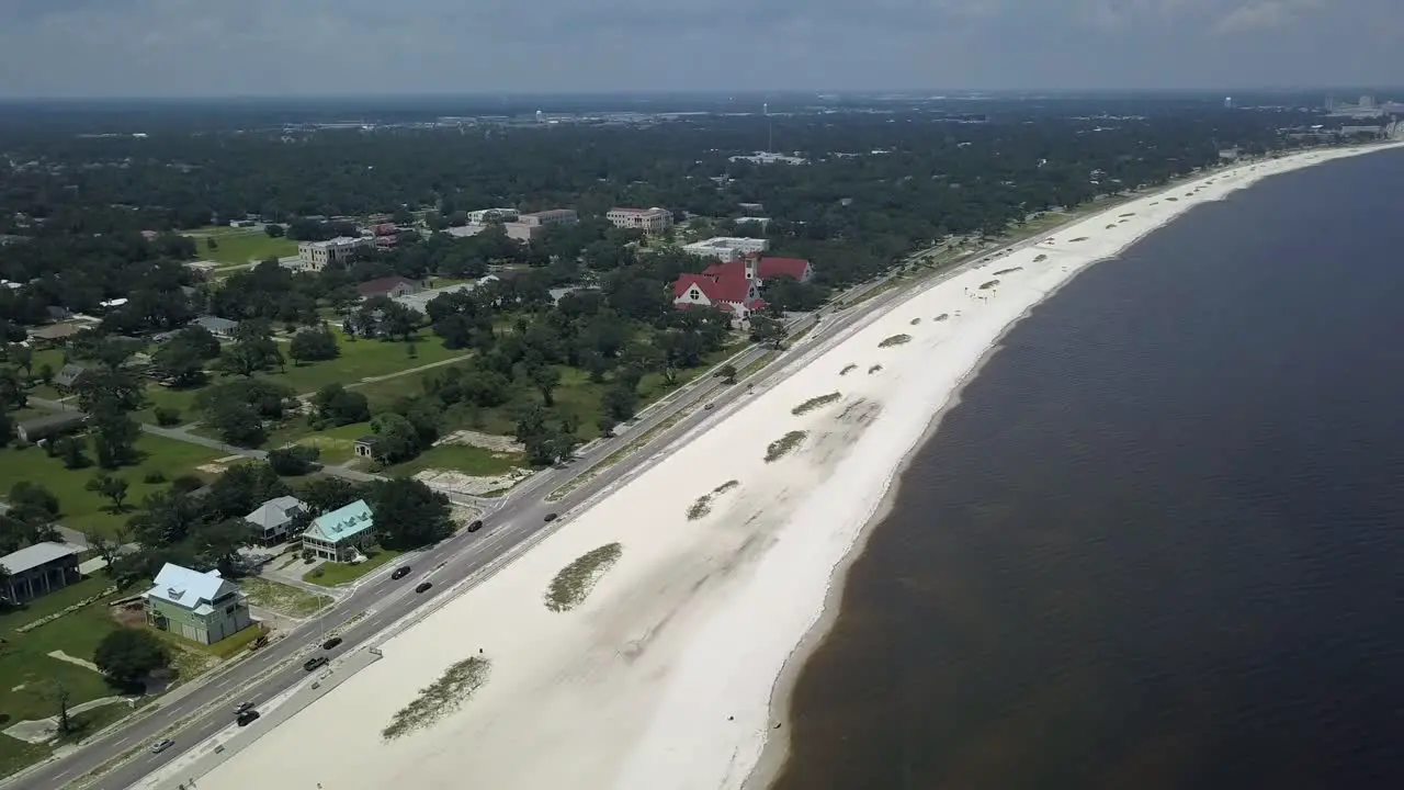 Truck driving off in the distance off the shore in Long Beach Mississippi