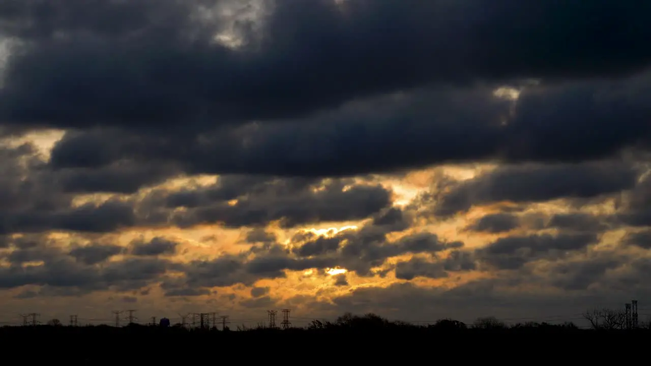 Nostalgic Sunrise Landscape with Clouds and Electrical Cables on the Horizon