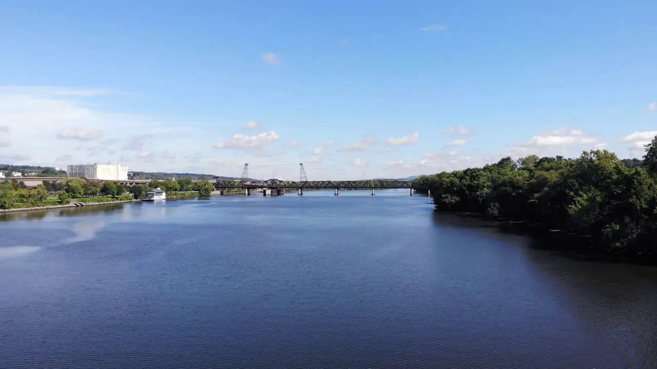 aerial over water near train bridge