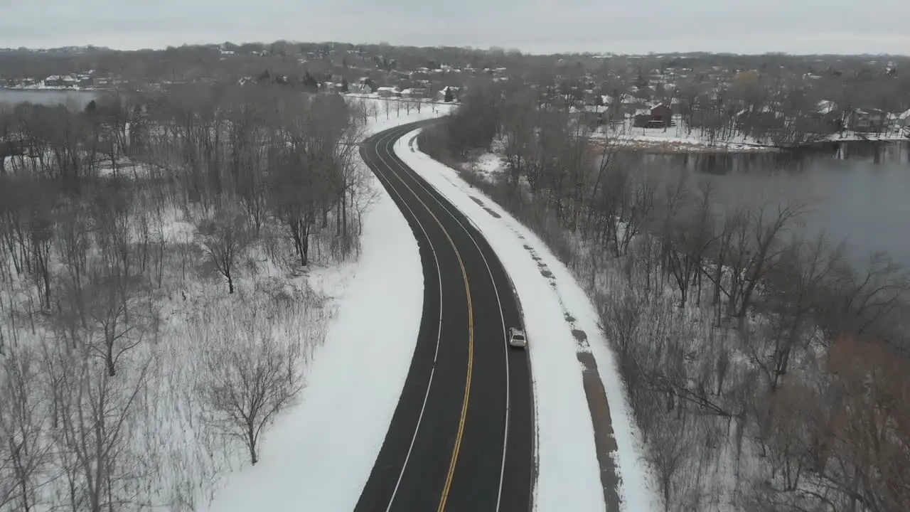 Aerial footage of a freeway in Minnesota during a cloudy winter afternoon