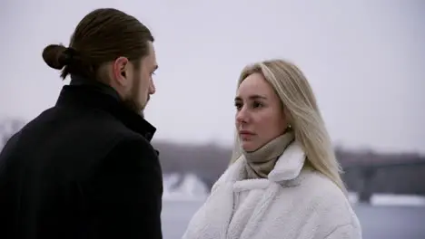 Man and woman standing outdoors