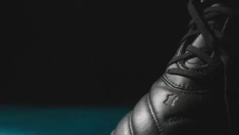 Studio Still Life Shot Of Football Soccer Boots Against Black Background 7