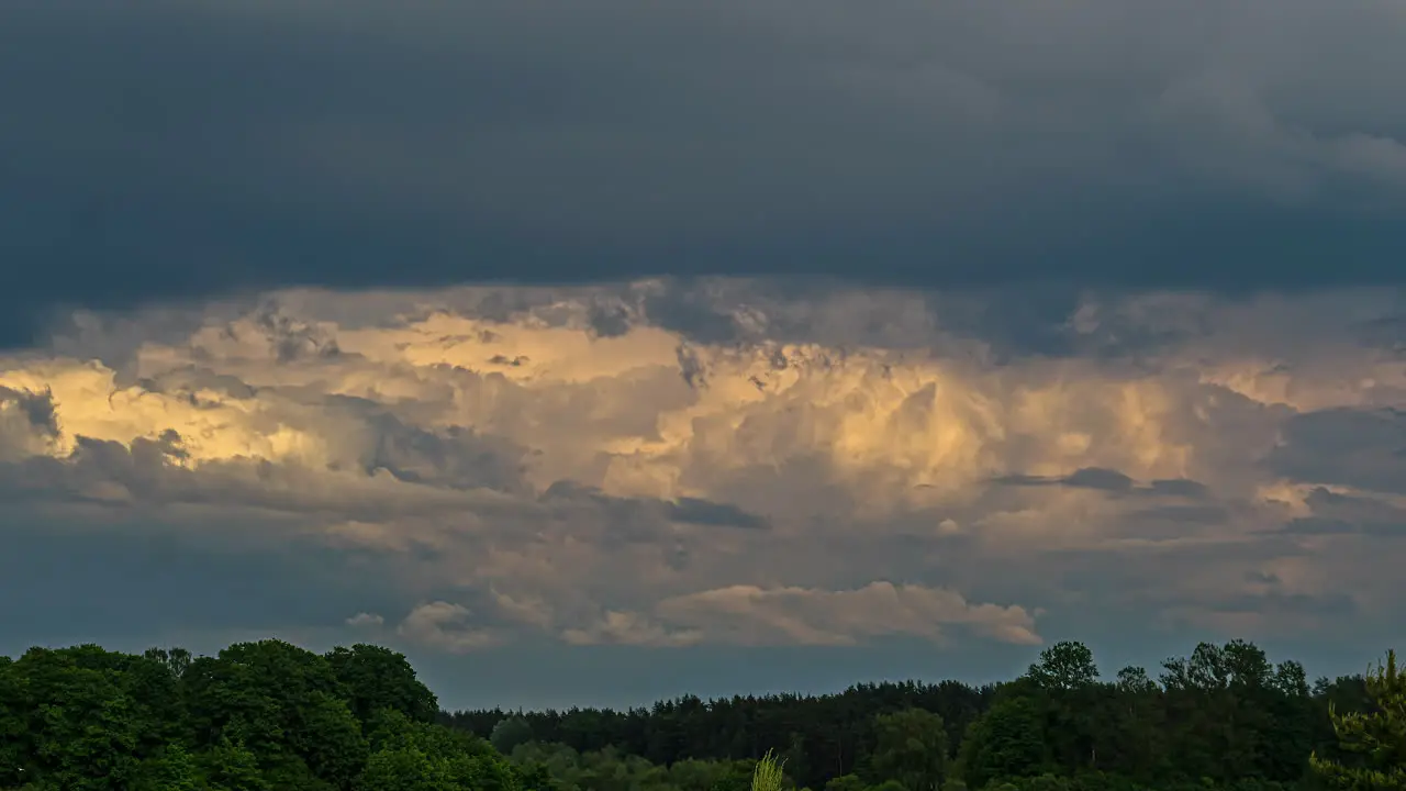 Dramatic Sunset Sky With Storm Clouds Rolling Over Green Forest