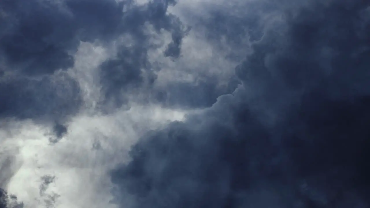 dark clouds moving in the sky with lightning strike