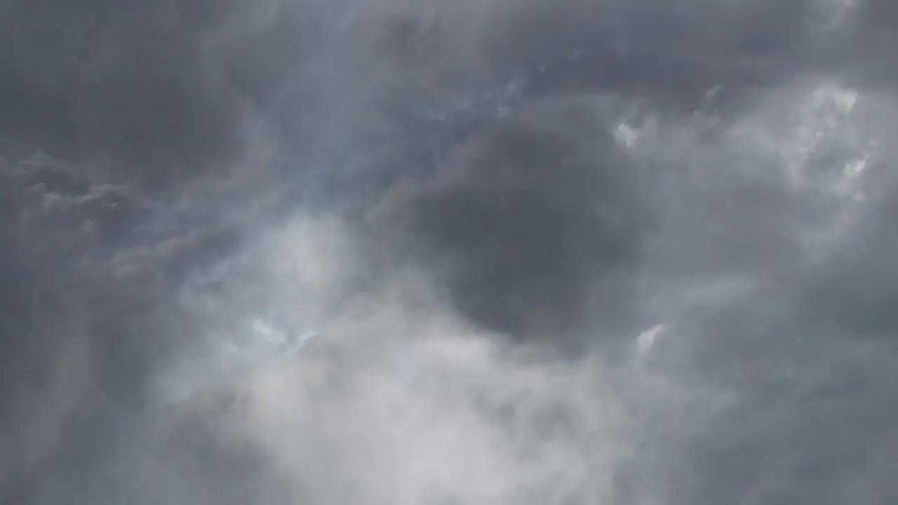 view of a thunderstorm that was going on inside the dark clouds