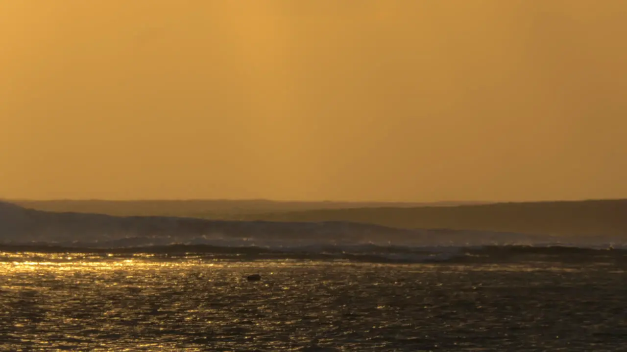 Ocean with strong waves at sunset