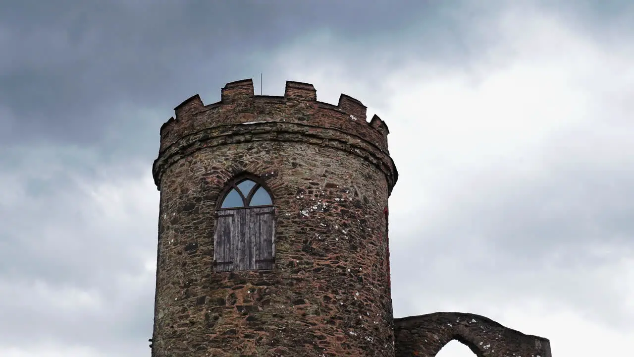 Castle tower timelapse with rolling storm clouds in the sky