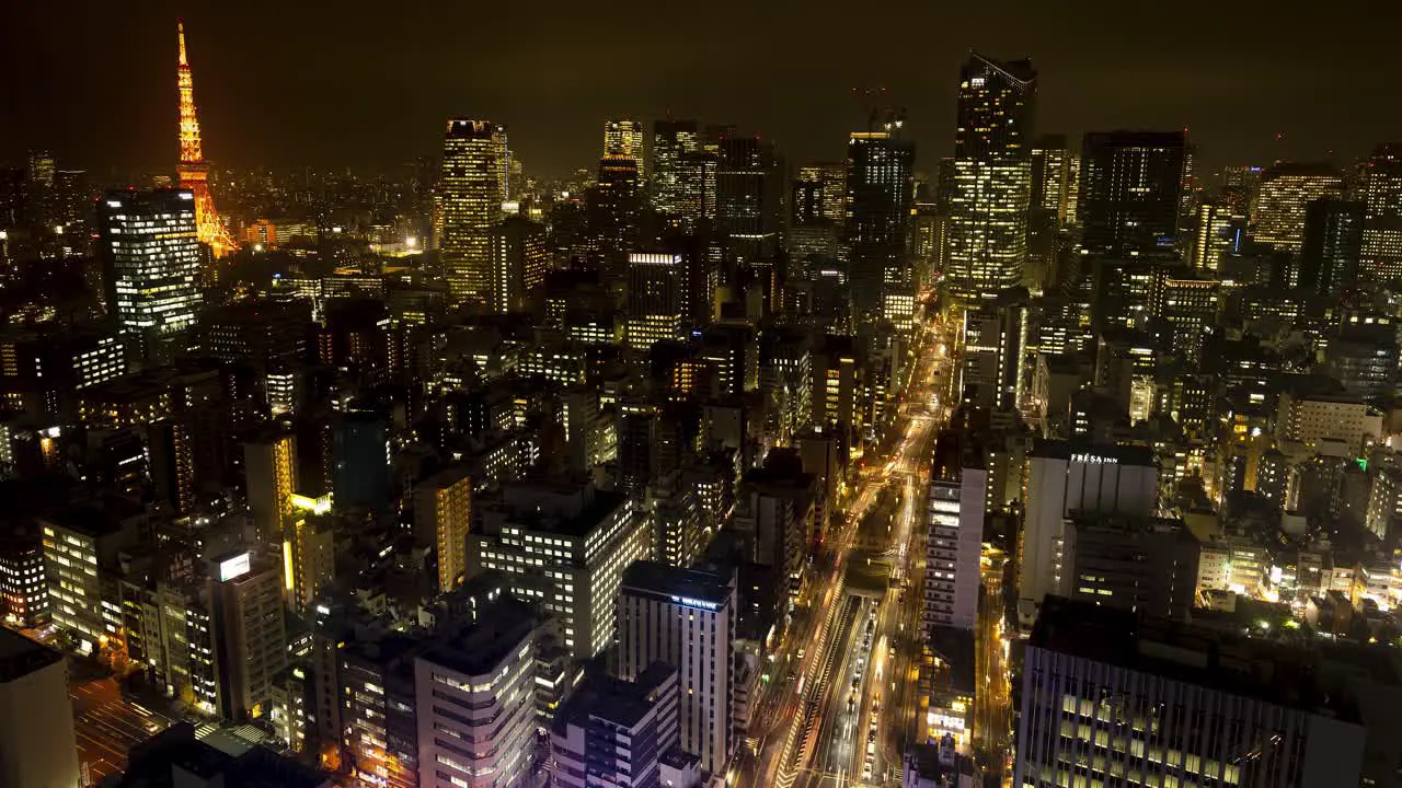 Tokyo city night time lapse aerial view shot from skyscraper busy megacity with moving lights