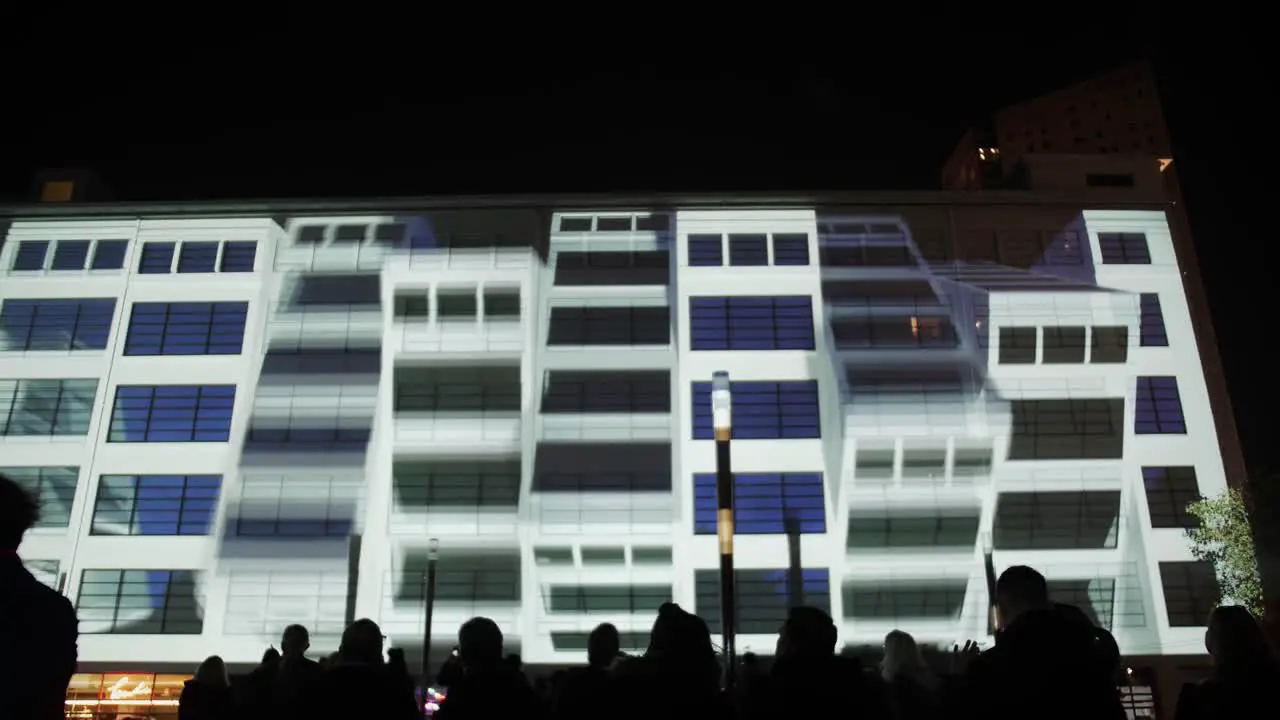 Light show on facade of large building at Glow festival in Eindhoven