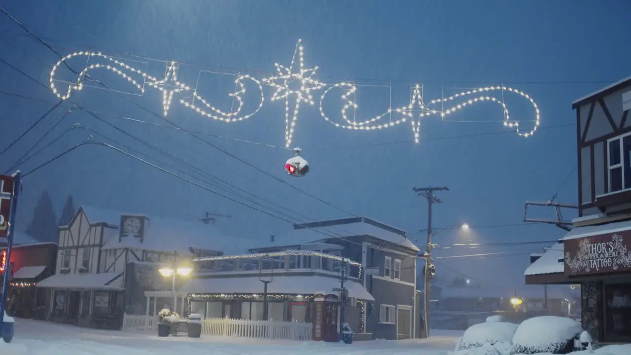 Early morning in Poulsbo Washington with a rare snowfall a view of downtown Christmas lights