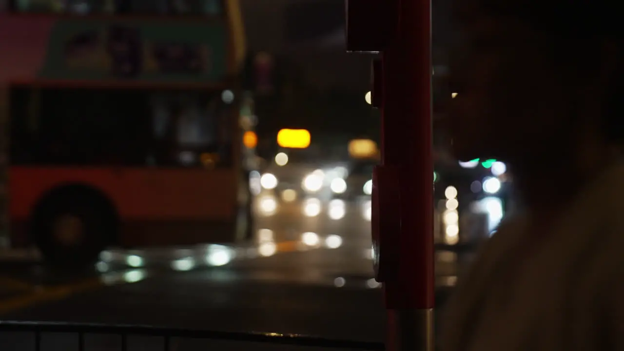 Nighttime side view of an out of focus busy street in Hong Kong