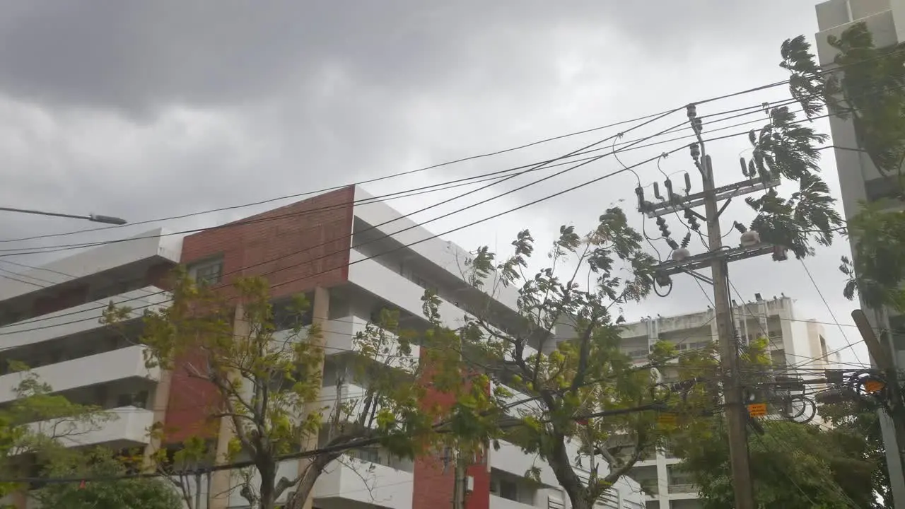 Stormy Weather Looking Up at Gray Clouds with a Building in the Foreground Thailand