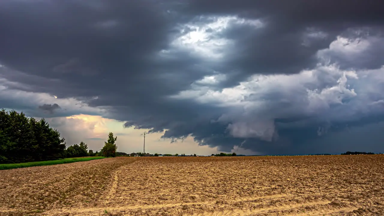 Dark Rain Clouds Billowing In The Sky Over Field On A Stormy Weather