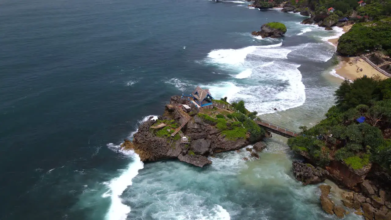 Aerial top down shot of KUKUP BEACH WITH CORAL ISLAND YOGYAKARTA INDONESIA