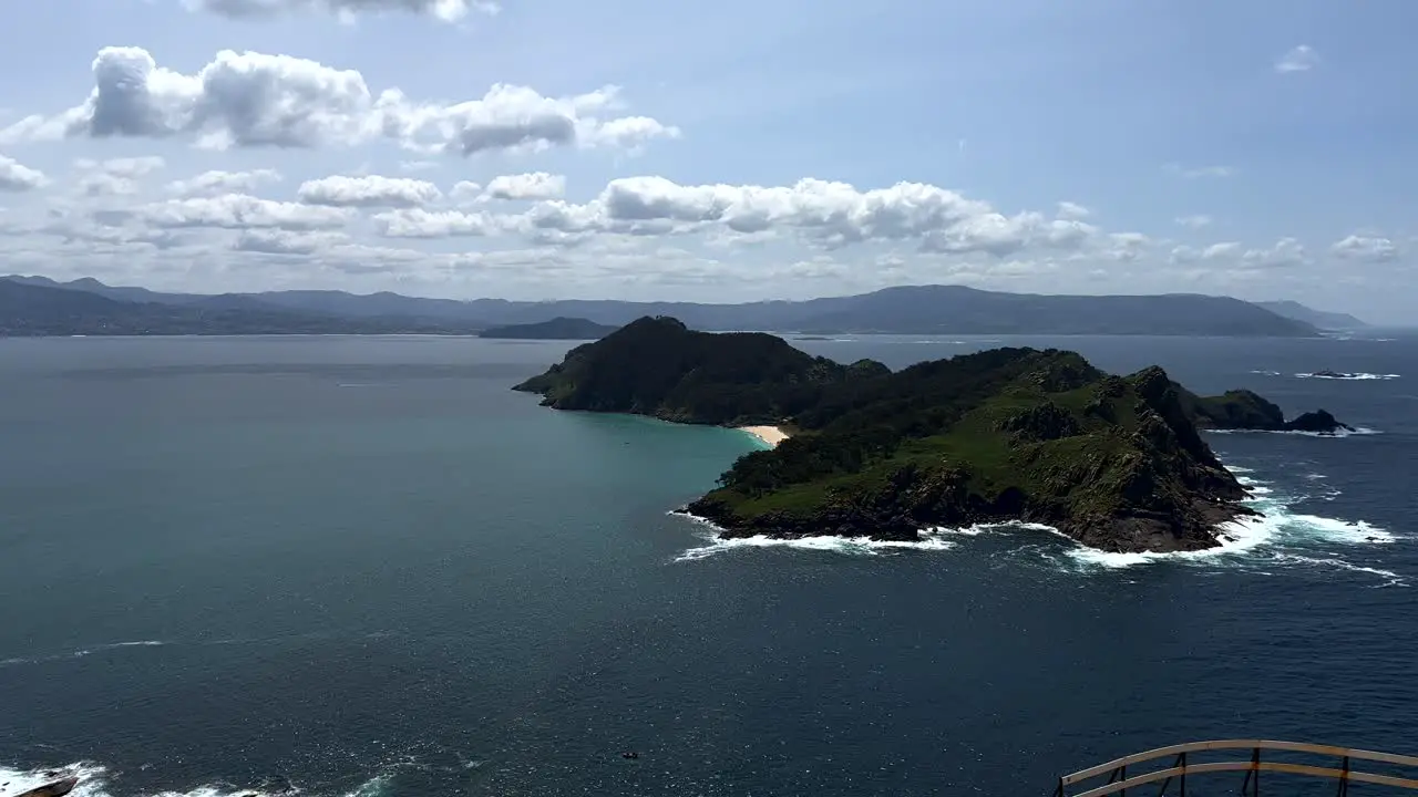 Aerial panorama view showing beautiful ocean view with islands and mountain range in background Cies Island Spain view from lighthouse