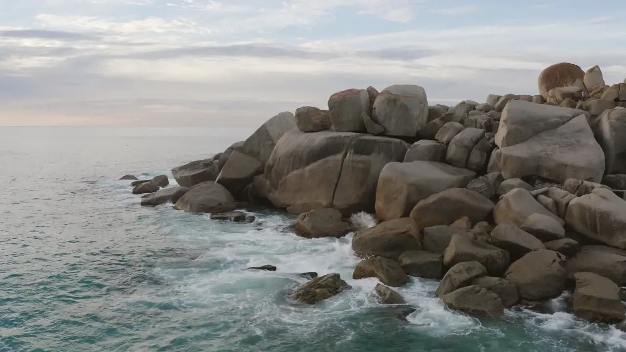 Small Waves Crashing On Rocks