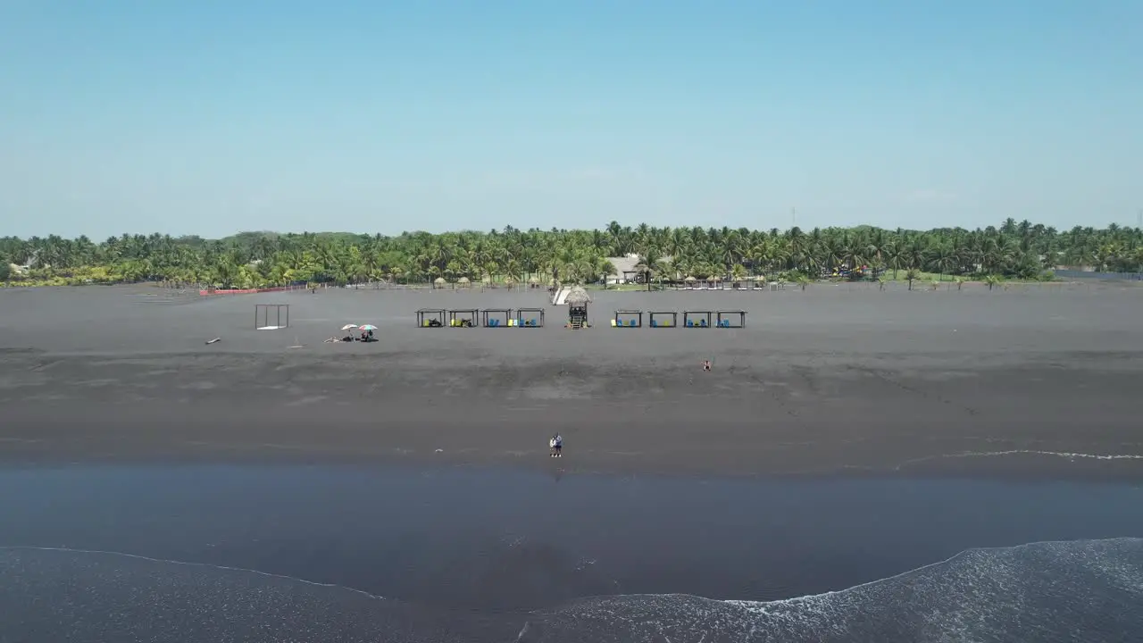 A stunning drone video capturing the beauty of a tropical beach from a unique angle showcasing the sandy shore crystal clear water and stunning scenery