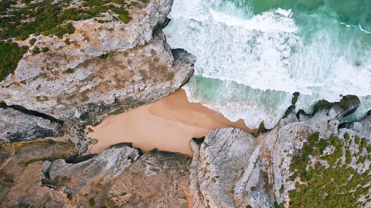 Tropical beach aerial view Top view of breaking waves on tropical beach