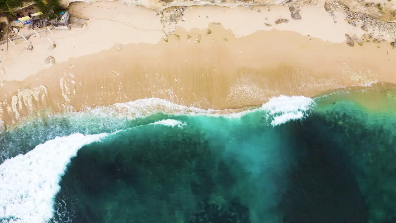 Turquoise ocean top view of Bali Indonesia tropical gold sand beach