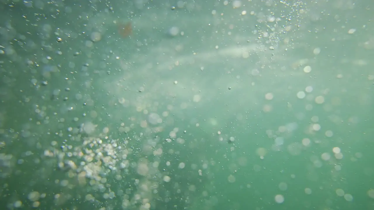 Underwater Bubbles with diver in background